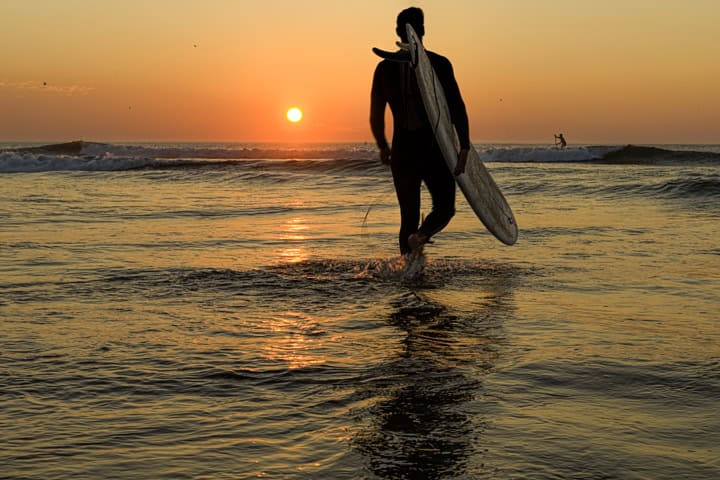 _JOE5217 Modern Barcelona tower shot from below, featuring sleek architecture against clear blue sky.